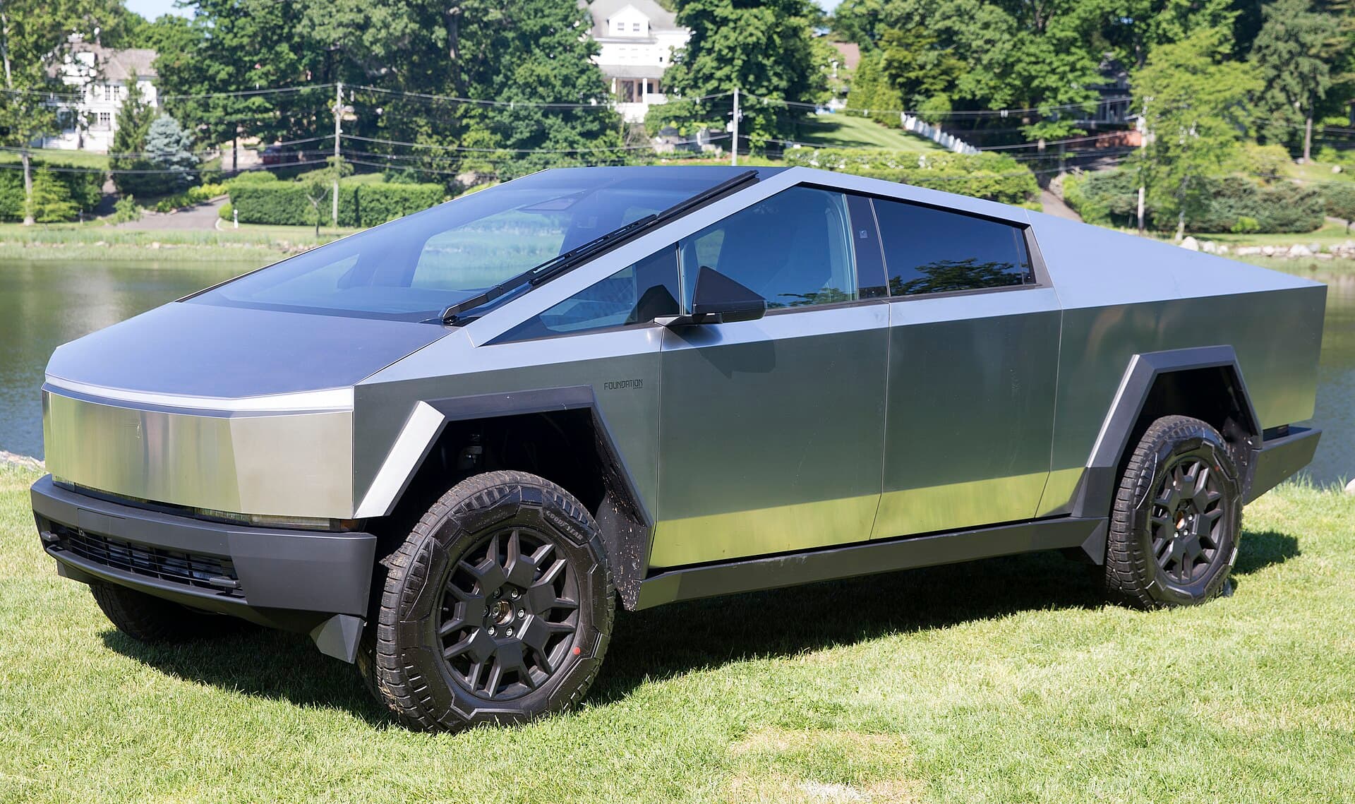 The Tesla Cybertruck, a futuristic electric pickup with sharp stainless steel panels